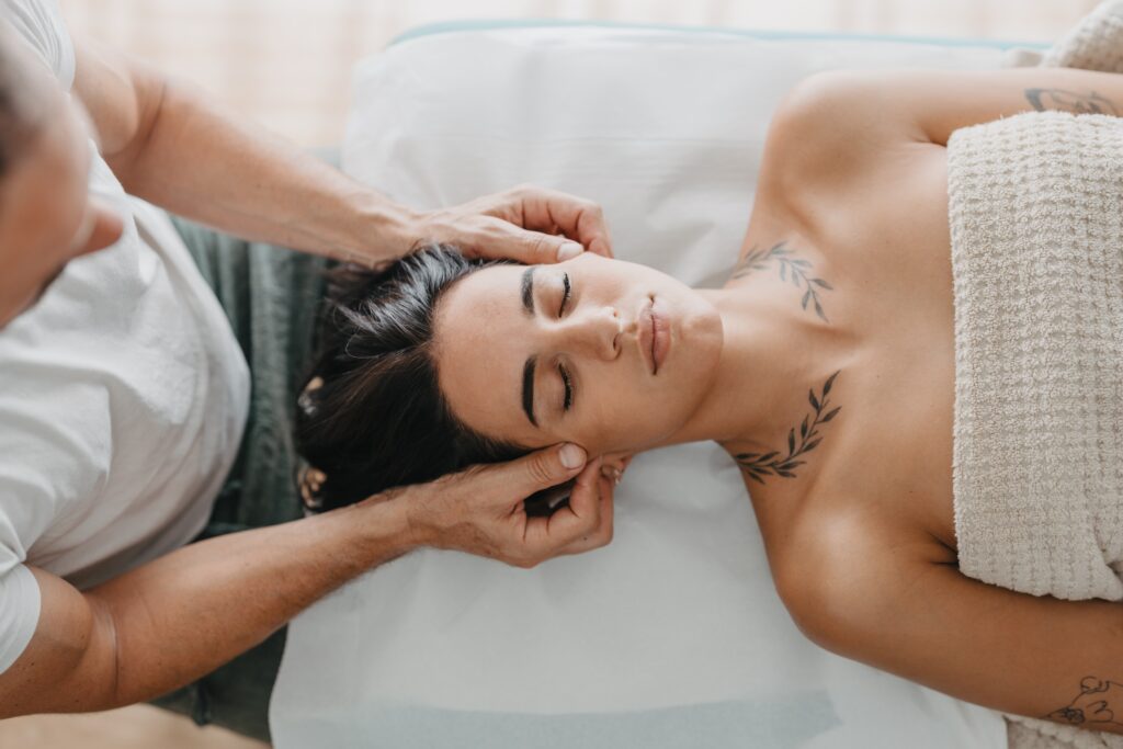 Therapist,Pinching,The,Skin,Of,A,Young,Woman's,Face,In